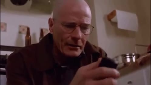 Walter White looking at phone GIF meme template